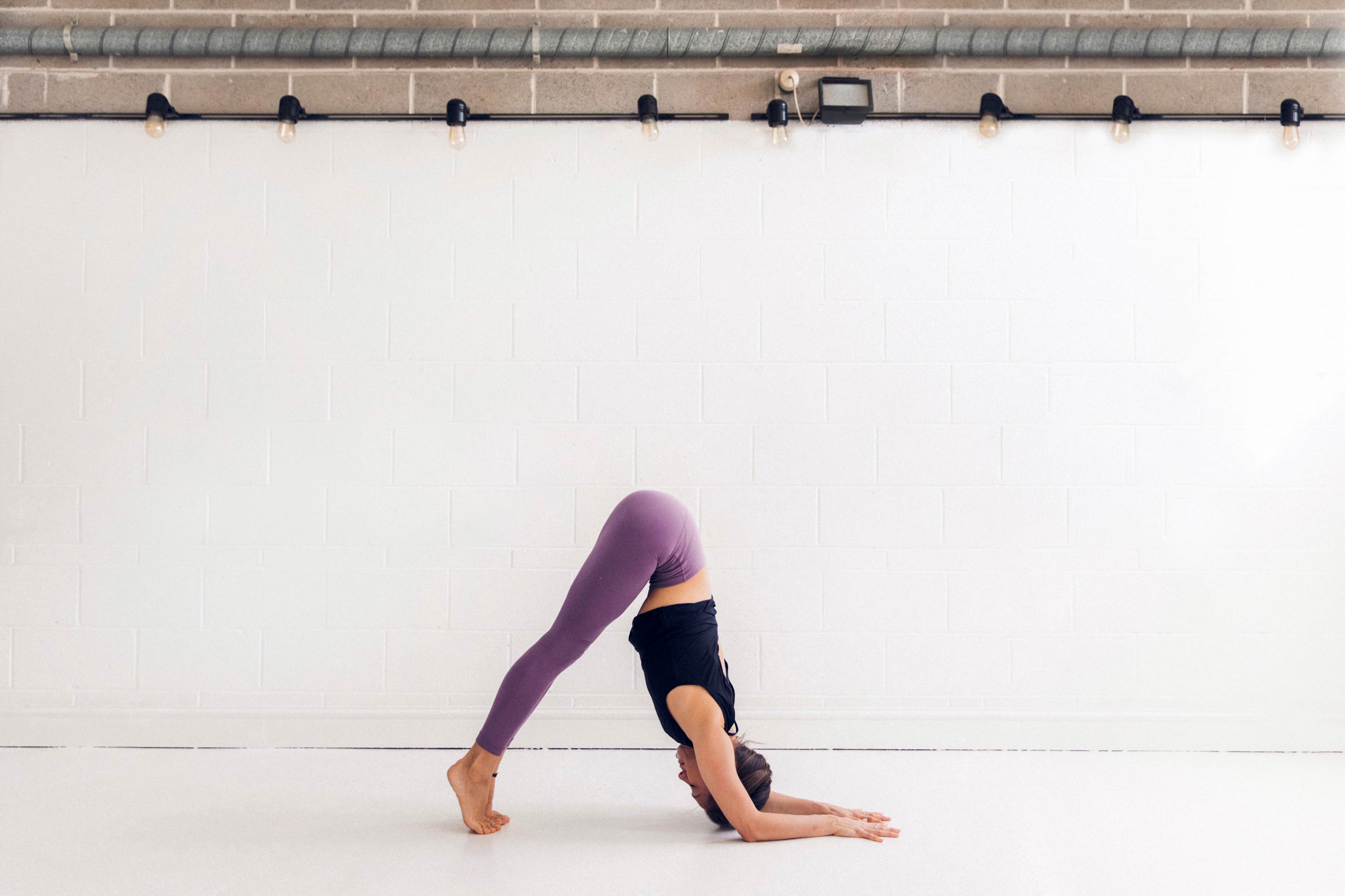 10 Best Yoga Wheel Poses, According To A Yoga Instructor